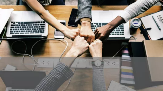 Team meeting fist bump