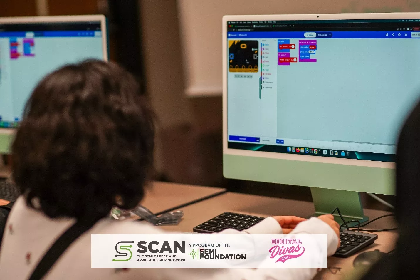 A student learns how to program a Micro:bit using a SEMI High Tech University