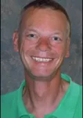 A close-up of a person smiling
Description automatically generated